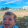 William joined the competition — help win amazing prizes! baby, child, blue_eyes, curly_hair, tongue_out, smiling, happy, outdoor, grass, field, sky, clouds, daylight, playful, person, infant, cute, blue_clothing, nature, sunny