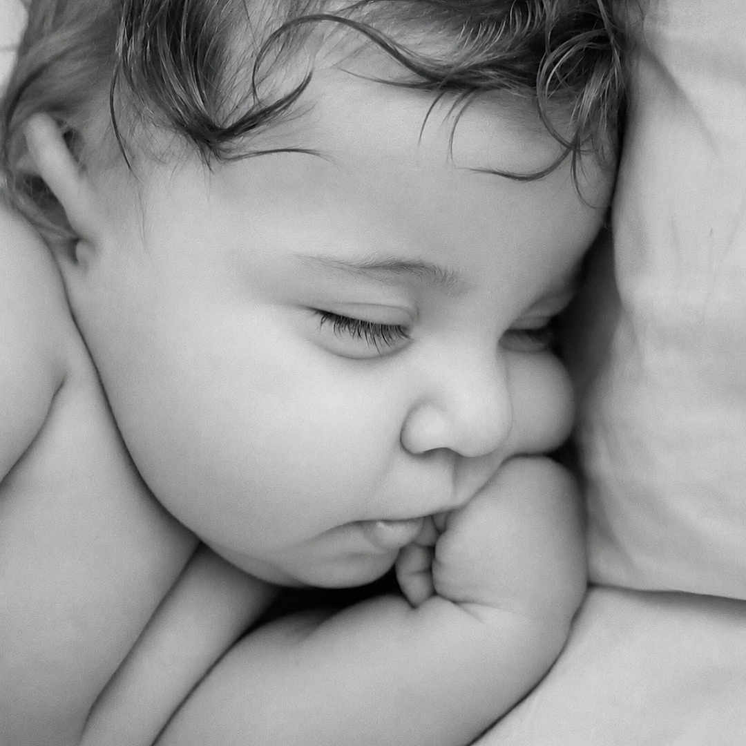 William is registered to the contest to win money with this photo: baby, sleeping, closeup, face, cheek, arm, pillow, skin, hair, peaceful, rest, child, infant, monochrome, black_and_white, portrait, cute, soft, relaxation, toddler