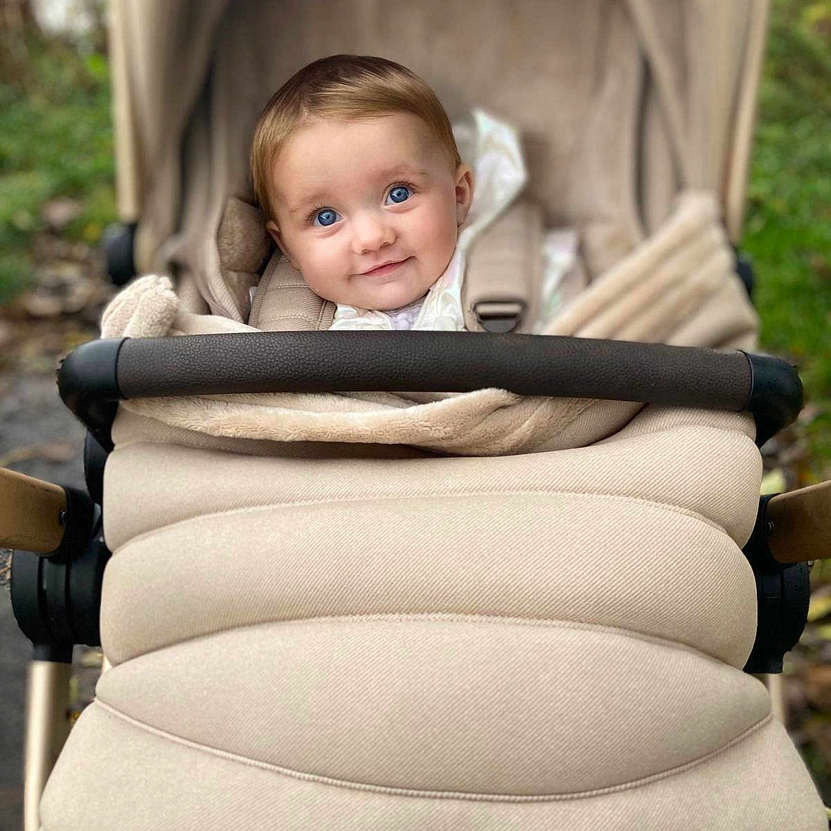 Grace joined the competition — help win amazing prizes! accessories, baby, bed, blanket, buggy, clothing, coat, face, furniture, happy, head, jacket, lady, newborn, person, photography, portrait, smile, strap, stroller