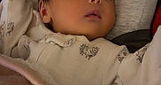 Xialani joined the competition — help win amazing prizes! baby, sleeping, blanket, onesie, animal_print, cushion, soft_lighting, peaceful, infant, indoors, cozy, face, head, resting, closeup, portrait, child, cute, warm, comfort