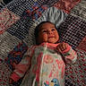 Xialani joined the competition — help win amazing prizes! baby, infant, smiling, onesie, floral_pattern, bird_embroidery, quilt, patchwork, bed, blanket, humdifier, glowing_light, indoor, child, cute, sleepwear, comfort, resting, person, cozy