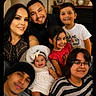 family, smiling, baby, child, adult, indoor, portrait, group, casual_clothing, glasses, black_hair, white_dress, headband, beard, tshirt, happy, closeup, people, home, diverse