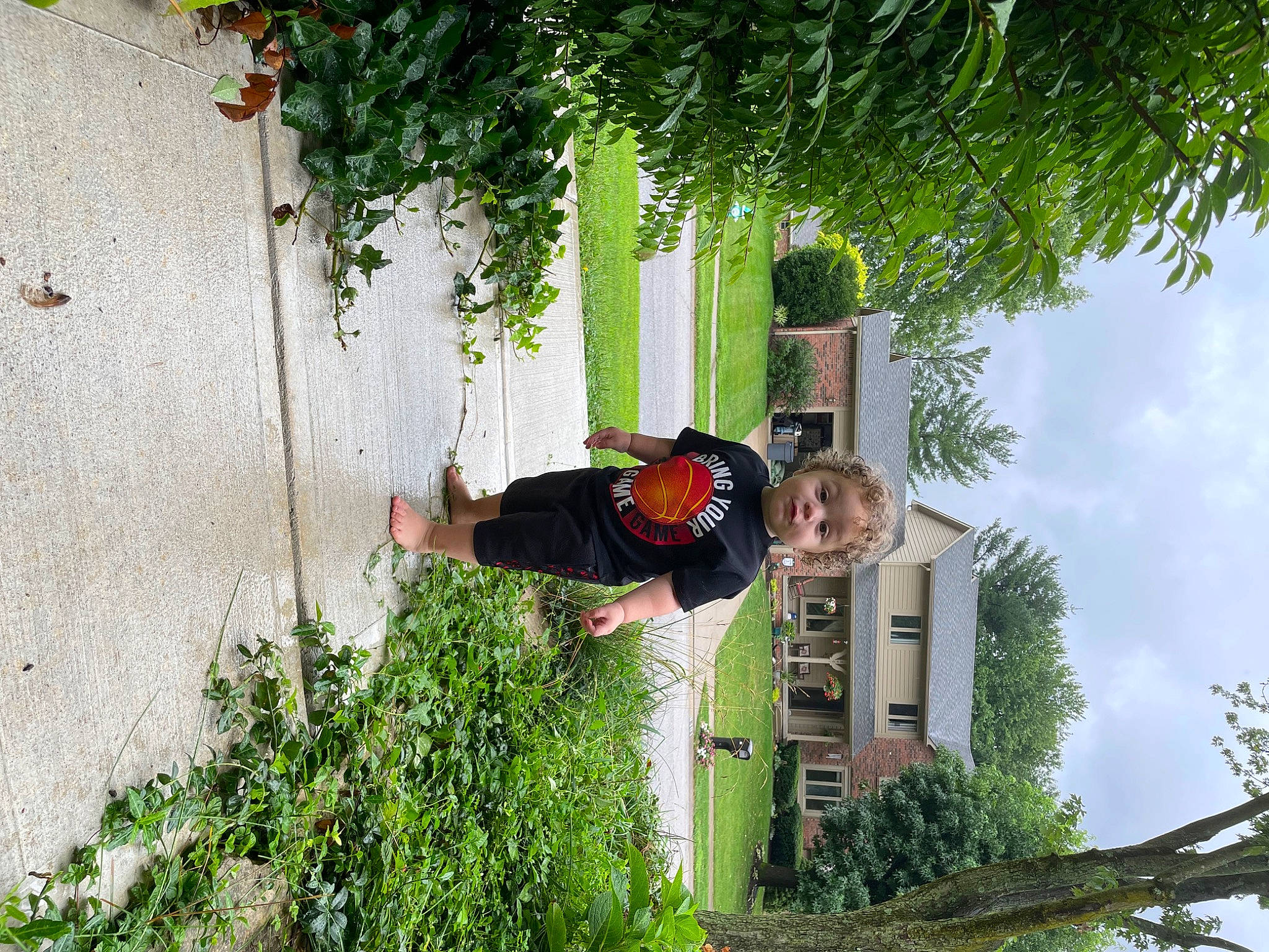 Kamdyn is registered to the contest to win money with this photo: building, cloud, facade, fun, grass, house, leaf, leisure, people_in_nature, person, plant, pole, shrub, sky, smile, tree, window