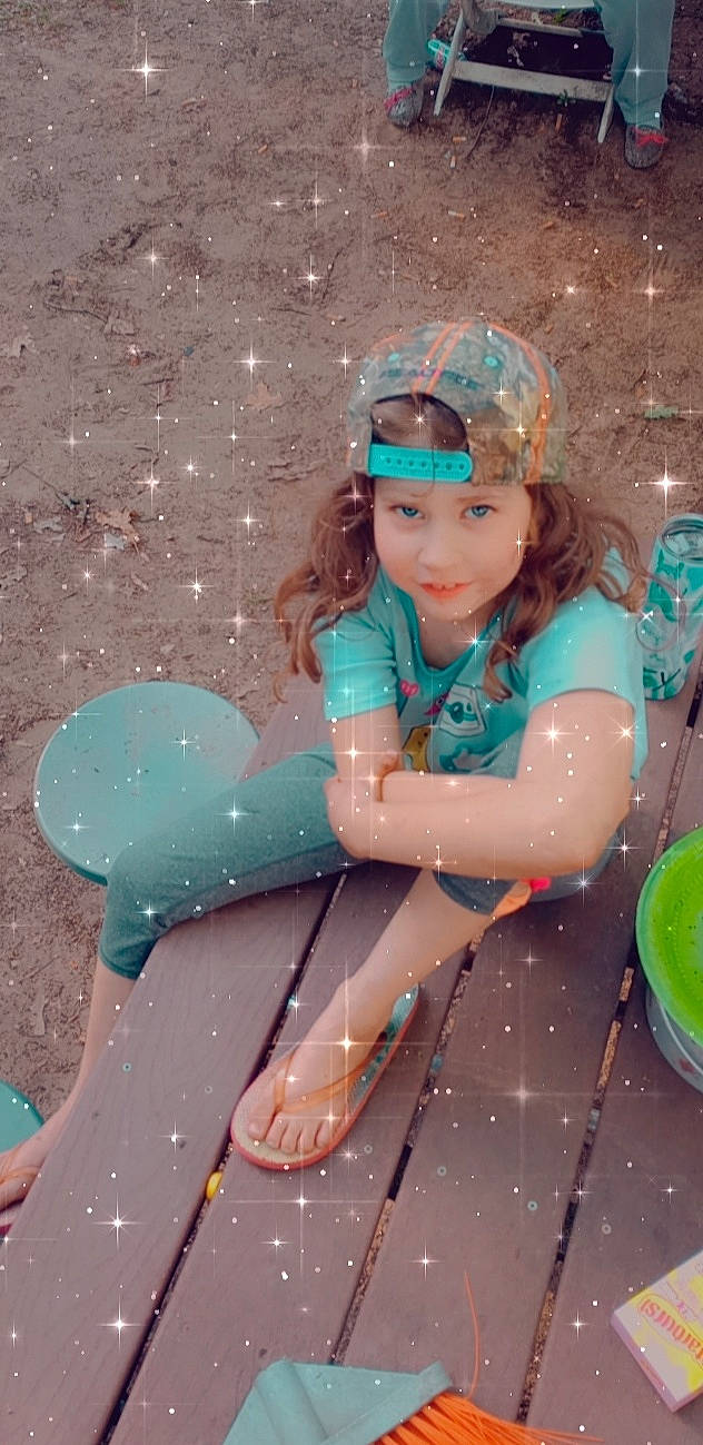 Bailey is registered to the contest to win money with this photo: aqua, child, costume, dress, event, fashion, fashion_design, fun, happy, headwear, human_body, jewellery, leisure, magenta, people_in_nature, person, pink, purple, recreation, sitting