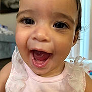 Emanuelly joined the competition — help win amazing prizes! baby, child, close_up, cute, expression, eyelashes, face, happy, head, indoor, infant, mouth, person, pink_clothing, portrait, ruffles, skin, smiling, tongue, young_child