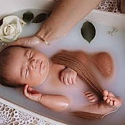Jeanne participe au concours pour gagner de l'argent avec cette photo : newborn, baby, milkbath, sleeping, flower, rose, leaves, hand, peaceful, skin, infant, water, tub, relaxation, soft, tinyhands, tinyfeet, closeup, portrait, calm