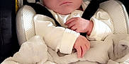 Damien is registered to the contest to win money with this photo: baby, blanket, car_seat, child, clothing, comfort, cute, expression, face, hat, headwear, indoor, infant, newborn, person, portrait, seat, soft, straps, wrapped