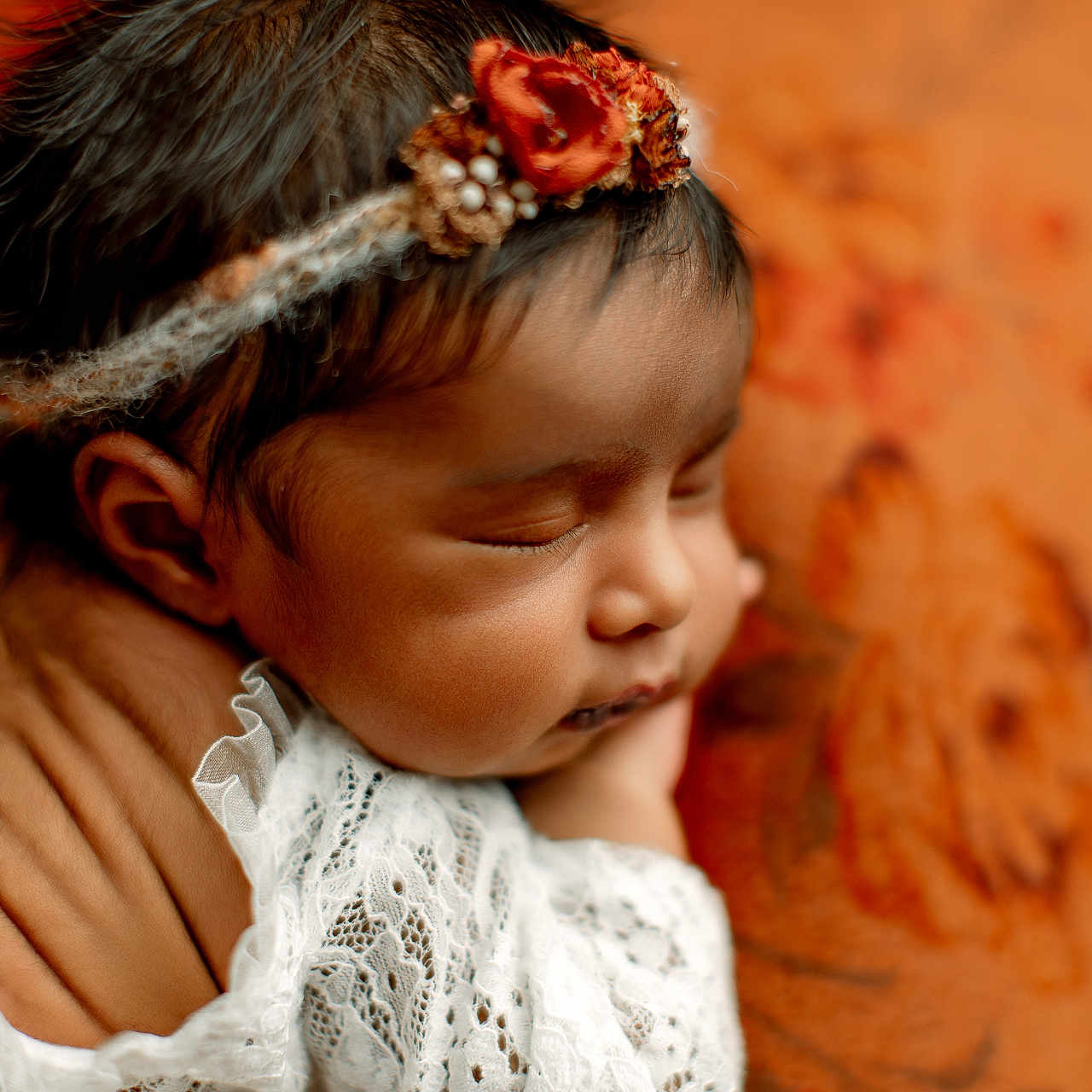 Srithi joined the competition — help win amazing prizes! baby, sleeping, face, headband, lace, hand, newborn, portrait, orange, flower, floral, blanket, closeup, peaceful, skin, cute, infant, resting, soft, warm
