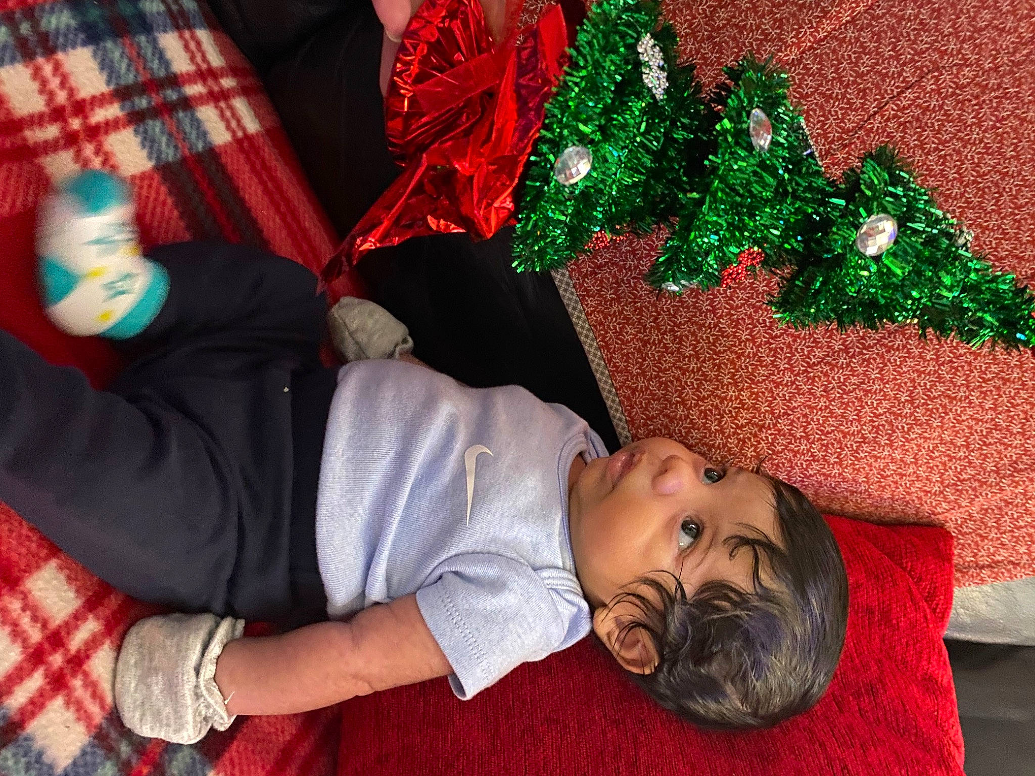 Jalen joined the competition — help win amazing prizes! carmine, child, christmas, christmas_decoration, christmas_ornament, christmas_tree, event, fun, gesture, green, happy, holiday, holiday_ornament, pattern, person, plaid, red, t_shirt, tartan, tradition