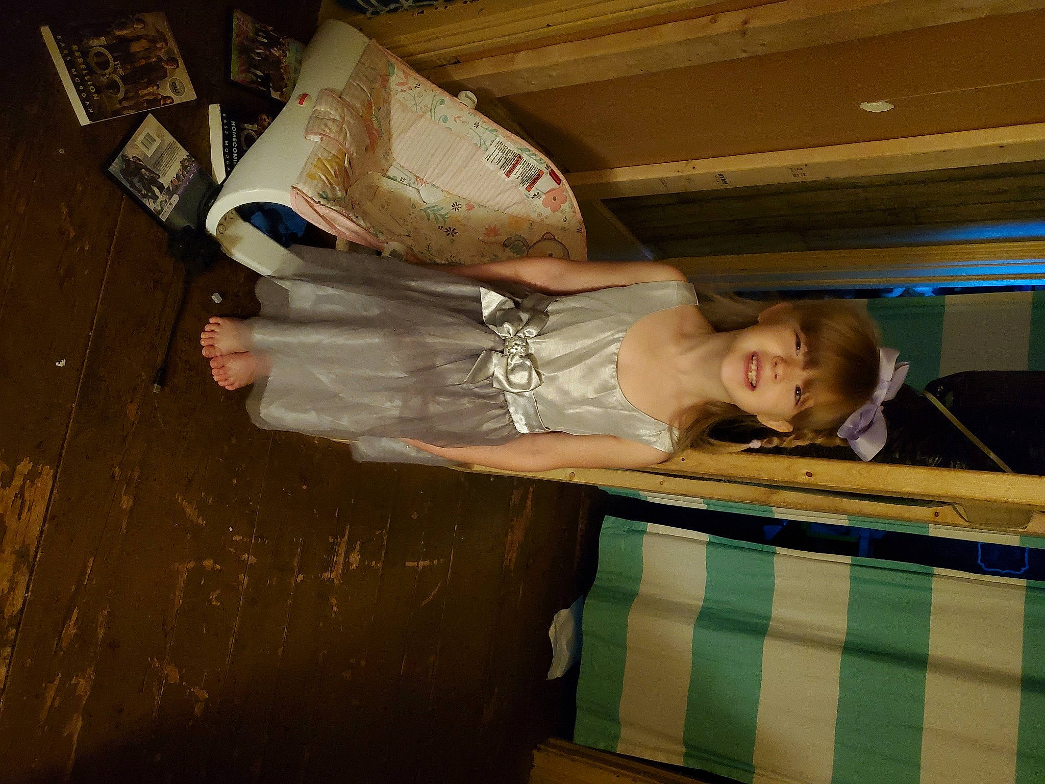 Renesmae is registered to the contest to win money with this photo: comfort, dress, flash_photography, flooring, fun, happy, hardwood, human_leg, joy, leisure, luxury_vehicle, person, room, smile, vintage_clothing, wood