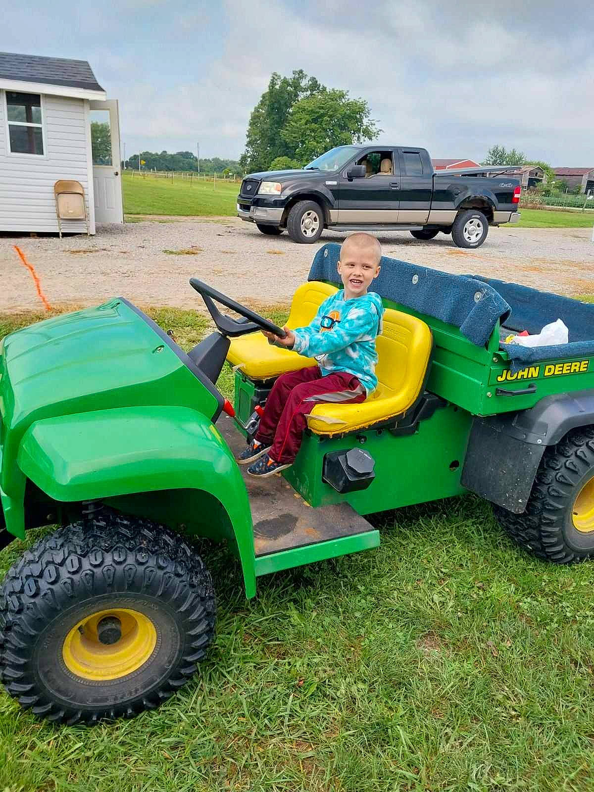 Sean joined the competition — help win amazing prizes! agricultural_machinery, automotive_design, automotive_exterior, automotive_tire, bumper, car, cloud, fender, grass, joy, land_vehicle, motor_vehicle, person, plant, sky, synthetic_rubber, tire, tread, tree, vehicle