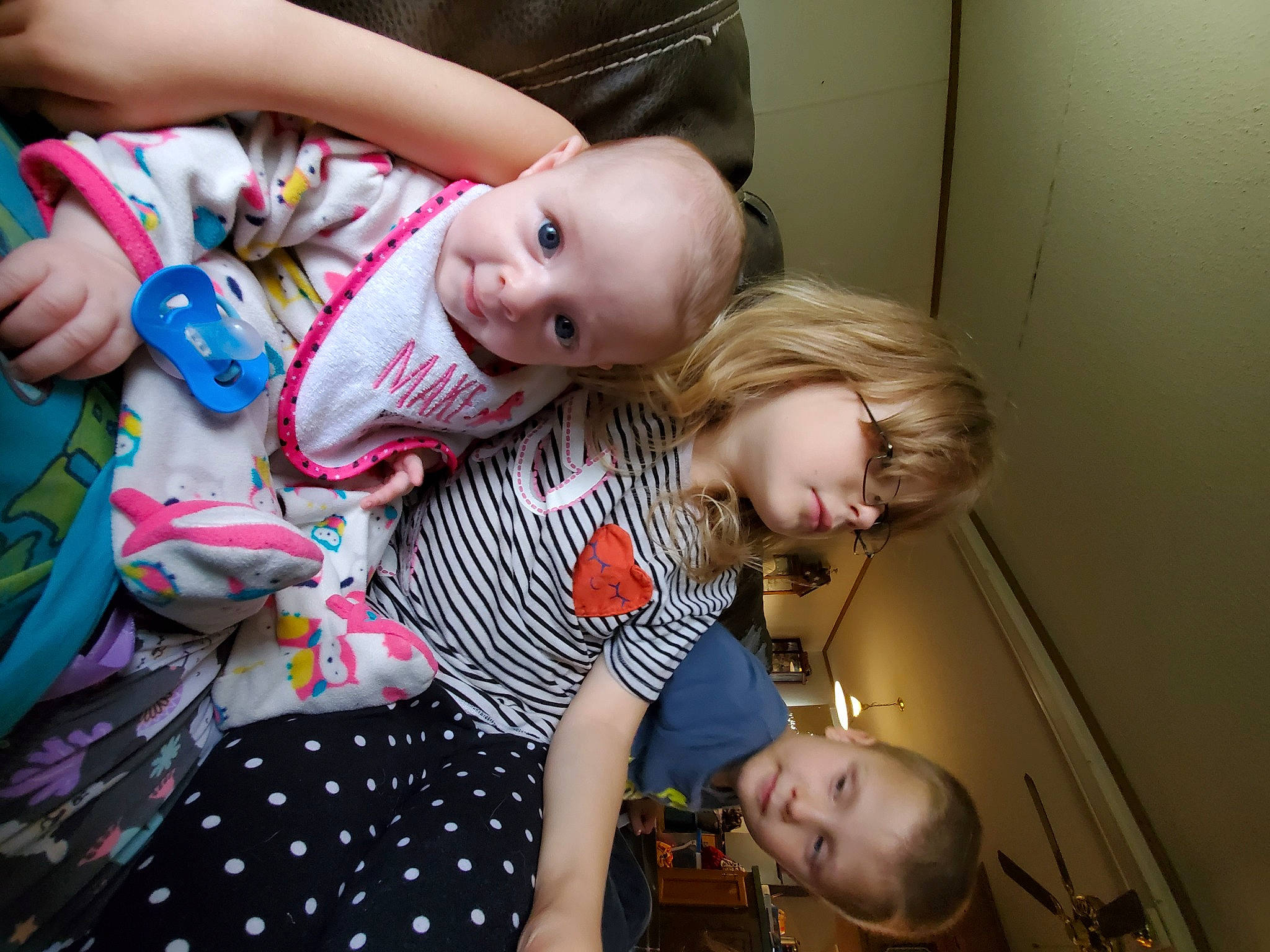 Bethany is registered to the contest to win money with this photo: arm, baby, baby_products, baby_toddler_clothing, cheek, child, event, fun, happy, human_body, pattern, person, photograph, play, room, sitting, smile, toddler