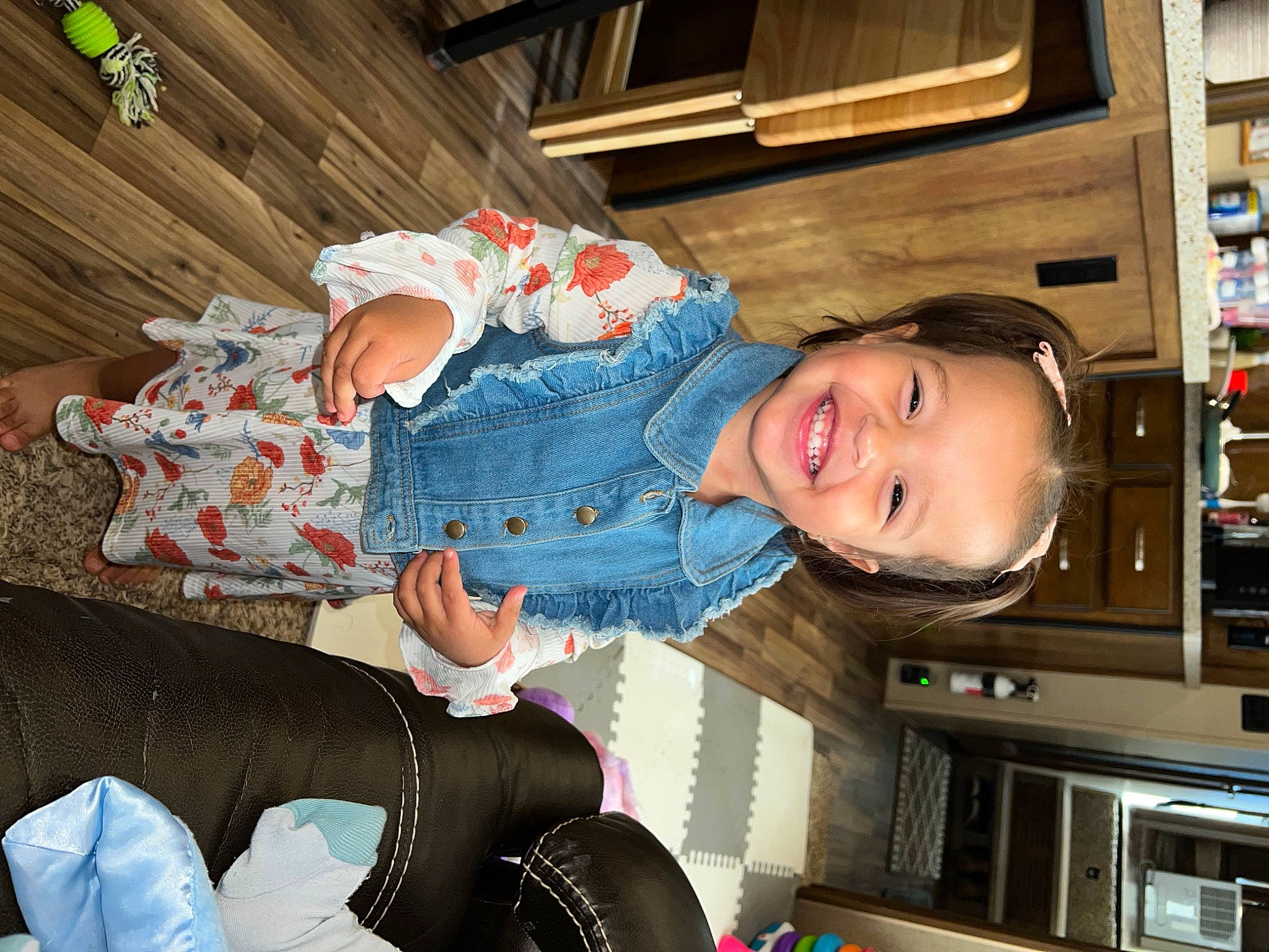 Brynnlee joined the competition — help win amazing prizes! baby, child, comfort, couch, eye, fun, happy, hat, human_leg, joy, lap, person, room, sitting, smile, sock, stocking, thigh, toddler, vacation