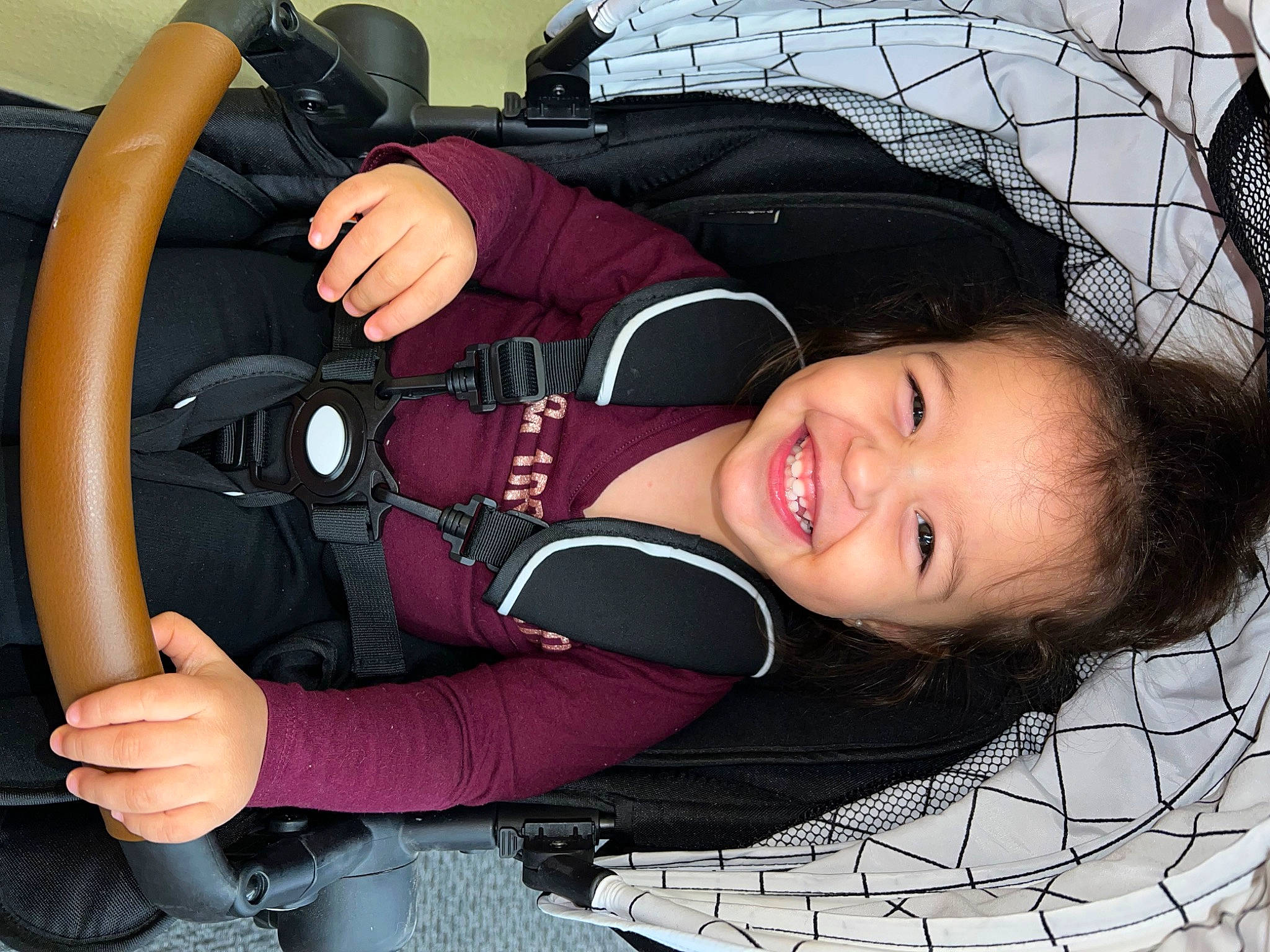 Brynnlee is registered to the contest to win money with this photo: auto_part, automotive_design, baby_carriage, baby_products, car_seat, car_seat_cover, child, comfort, cool, facial_expression, flash_photography, fun, happy, joy, motor_vehicle, person, smile, steering_part, steering_wheel, toddler