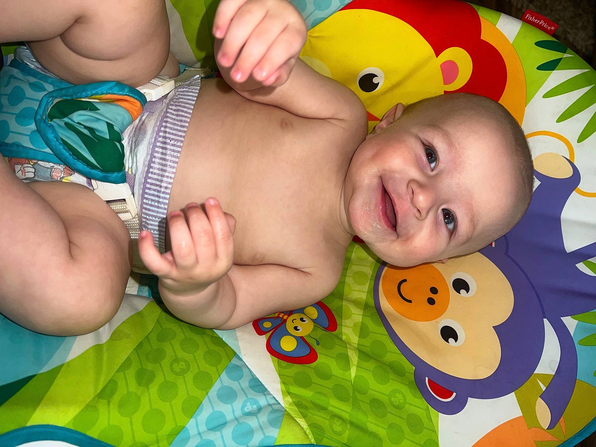 Wyatt is registered to the contest to win money with this photo: baby, baby_products, baby_toddler_clothing, cheek, chest, child, fun, grass, green, happy, joy, leisure, pattern, people, person, product, skin, smile, textile, thumb