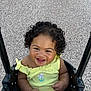 baby, child, swing, smiling, curly_hair, yellow_clothing, outdoor, playground, happy, infant, person, cute, portrait, seat, joyful, young_child, embroidery, flower, black_swing, texture