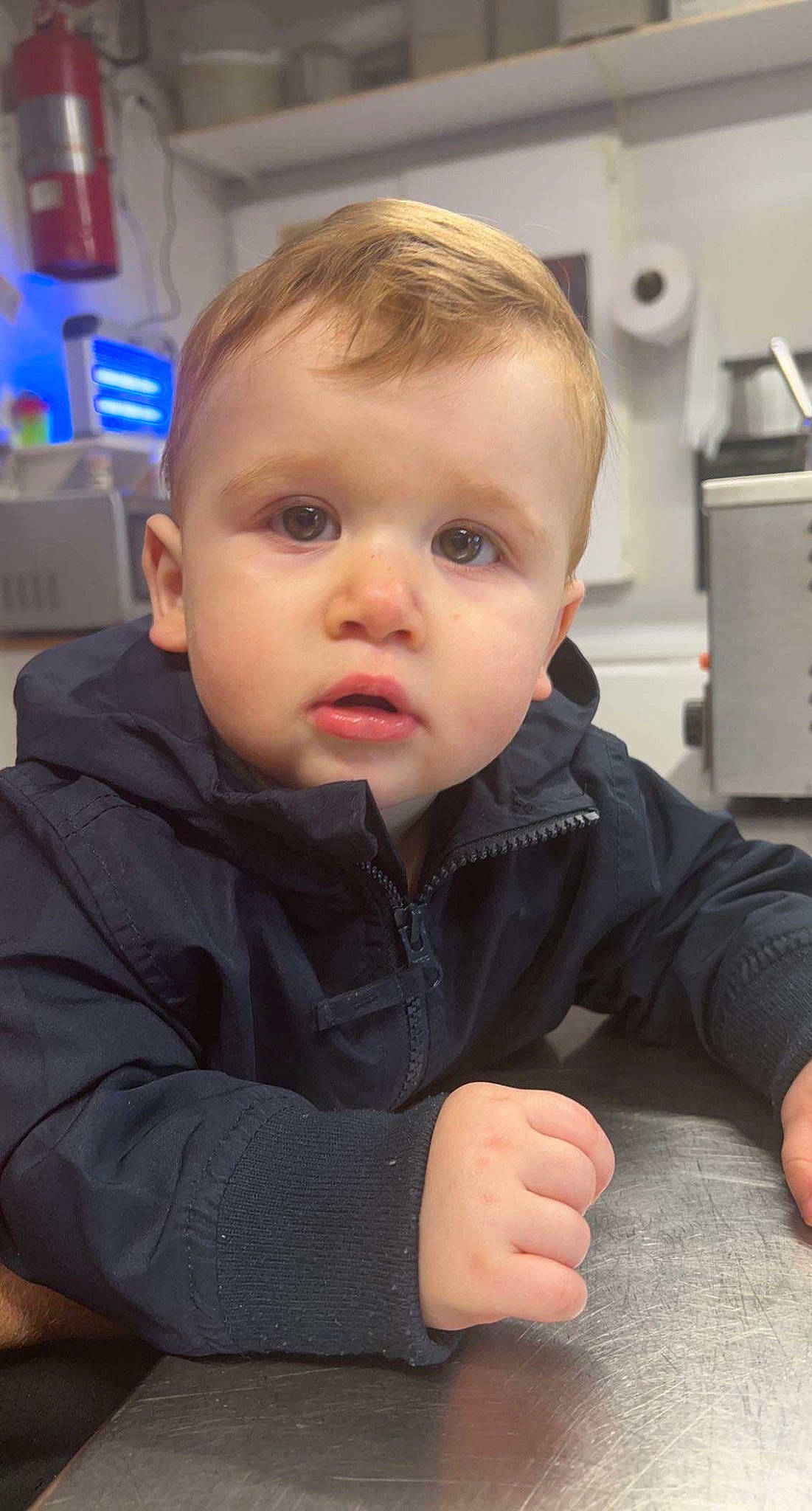 Olivier is registered to the contest to win money with this photo: baby, baby_toddler_clothing, cheek, child, chin, comfort, eye, eyebrow, finger, flooring, fun, gesture, hairstyle, nose, person, sitting, skin, sleeve, thumb, toddler