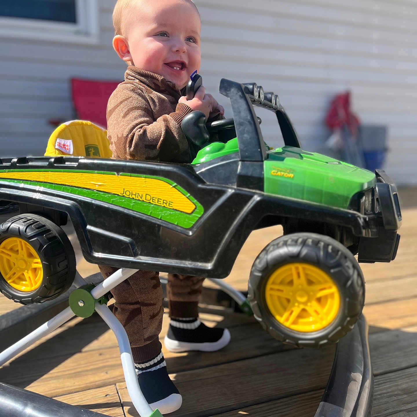 Justyce joined the competition — help win amazing prizes! baby, clothing, device, face, footwear, grass, head, lawn, lawnmower, machine, outdoors, person, photography, plant, portrait, shoe, tool, toy, wheel, wood