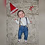 baby, child, smiling, white_shirt, blue_jeans, suspenders, socks, red_hat, christmas, holiday, fluffy_rug, face, cute, infant, lying_down, decor, number_one, warm, joyful, celebration