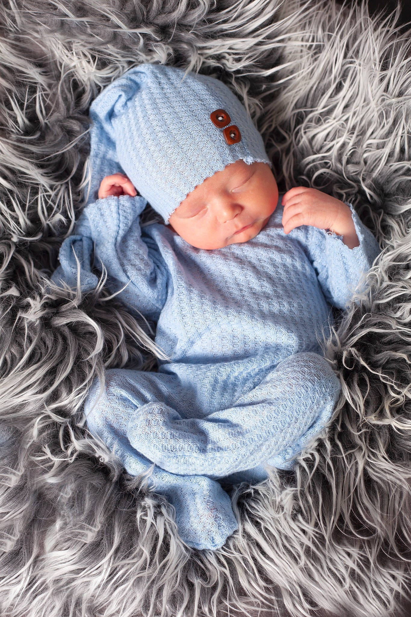 Sylas is registered to the contest to win money with this photo: baby, baby_toddler_clothing, beanie, cap, child, comfort, fur, grass, grey, head, headgear, headwear, knit_cap, linens, pattern, person, sitting, textile, toddler, tree