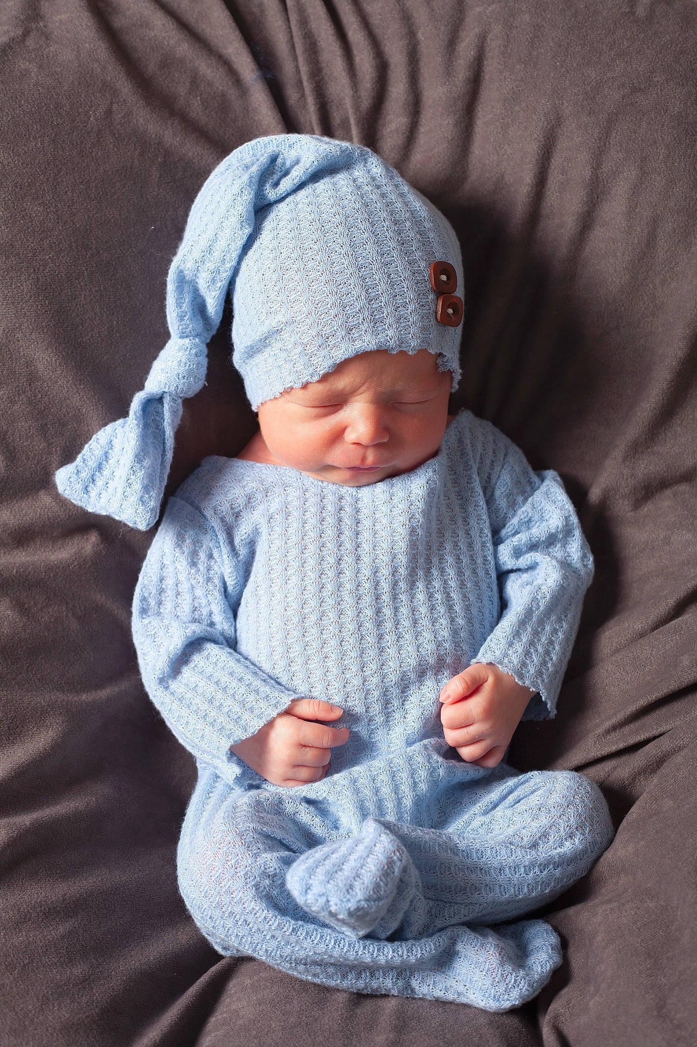 Sylas is registered to the contest to win money with this photo: baby, baby_products, baby_toddler_clothing, beanie, bonnet, cap, cheek, child, comfort, electric_blue, face, grey, headgear, headwear, knit_cap, pattern, person, sitting, sleeve, toddler