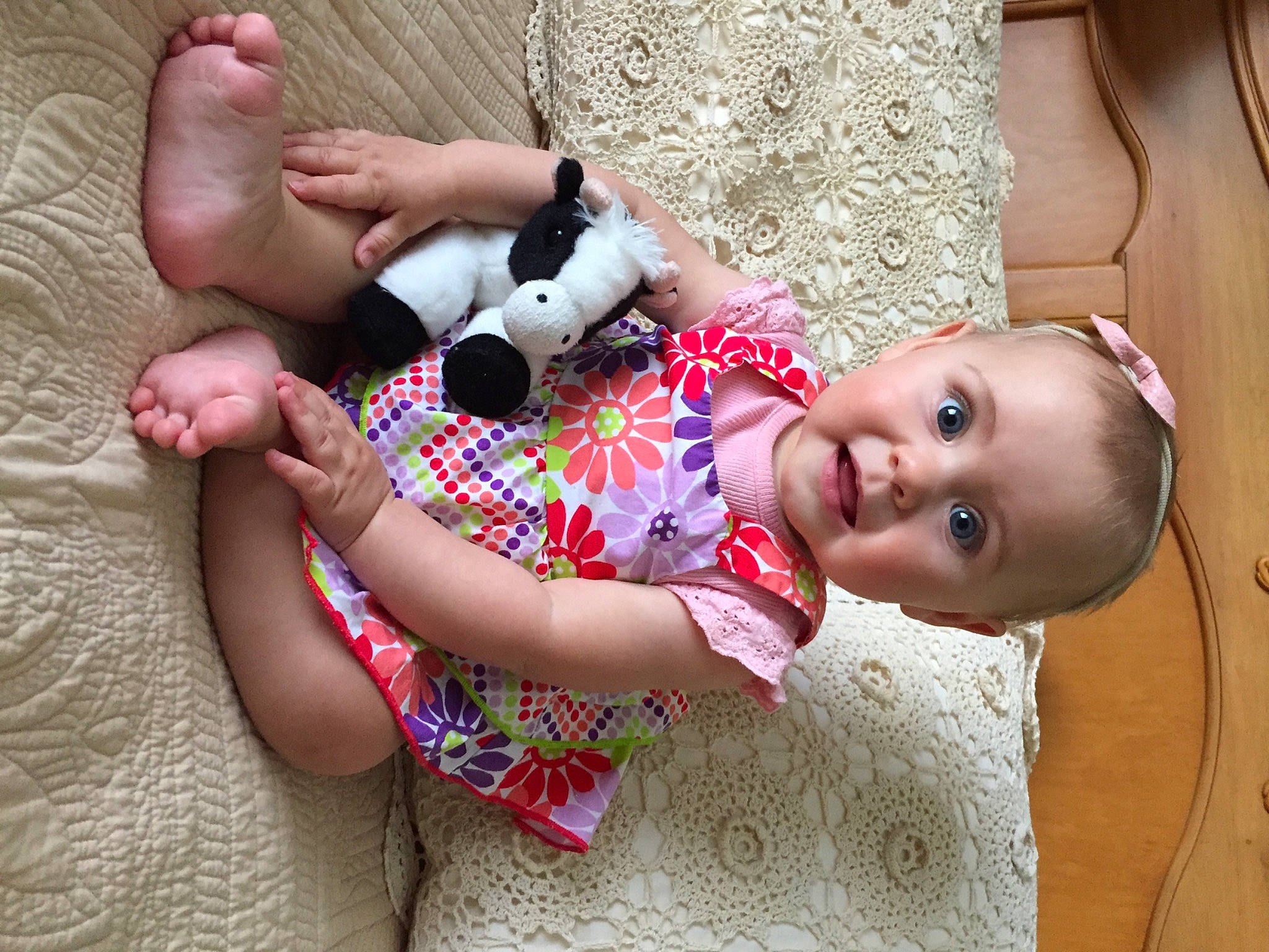 Coraline is registered to the contest to win money with this photo: baby, baby_toddler_clothing, child, fawn, finger, foot, fun, hand, happy, human_body, leg, mouth, nail, person, pink, skin, smile, surprise, textile, thigh