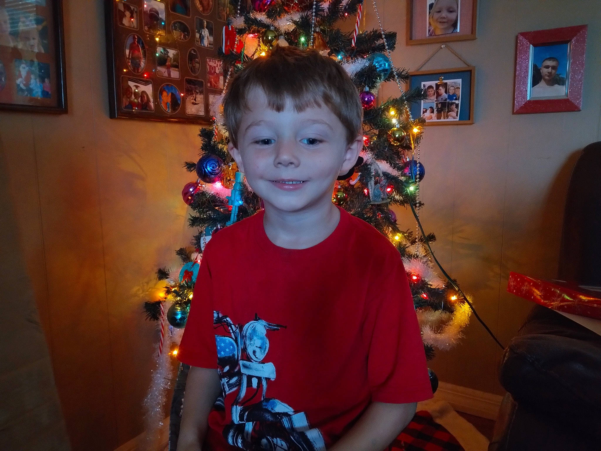 Braxton joined the competition — help win amazing prizes! child, christmas, christmas_decoration, christmas_ornament, christmas_tree, event, fun, happy, head, holiday, holiday_ornament, iris, joy, lighting, ornament, person, picture_frame, smile, standing, t_shirt