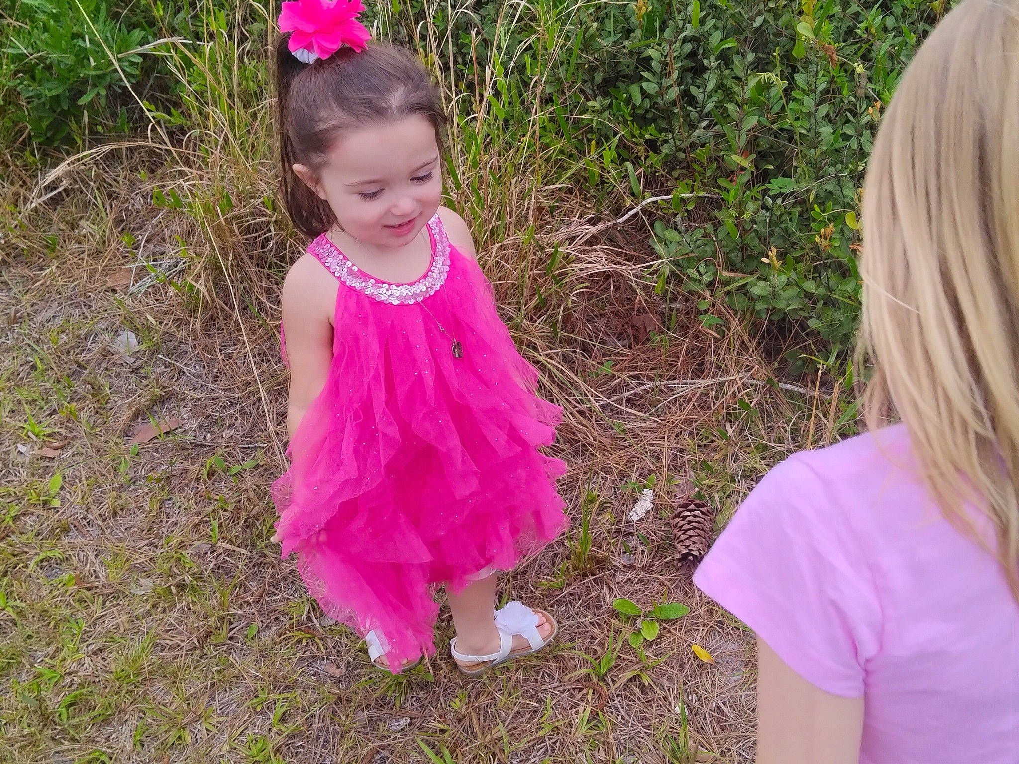 Jenna is registered to the contest to win money with this photo: baby_toddler_clothing, botany, child, eye, flower, fun, grass, happy, joy, leaf, magenta, nature, people_in_nature, person, pink, plant, purple, smile, terrestrial_plant, toddler