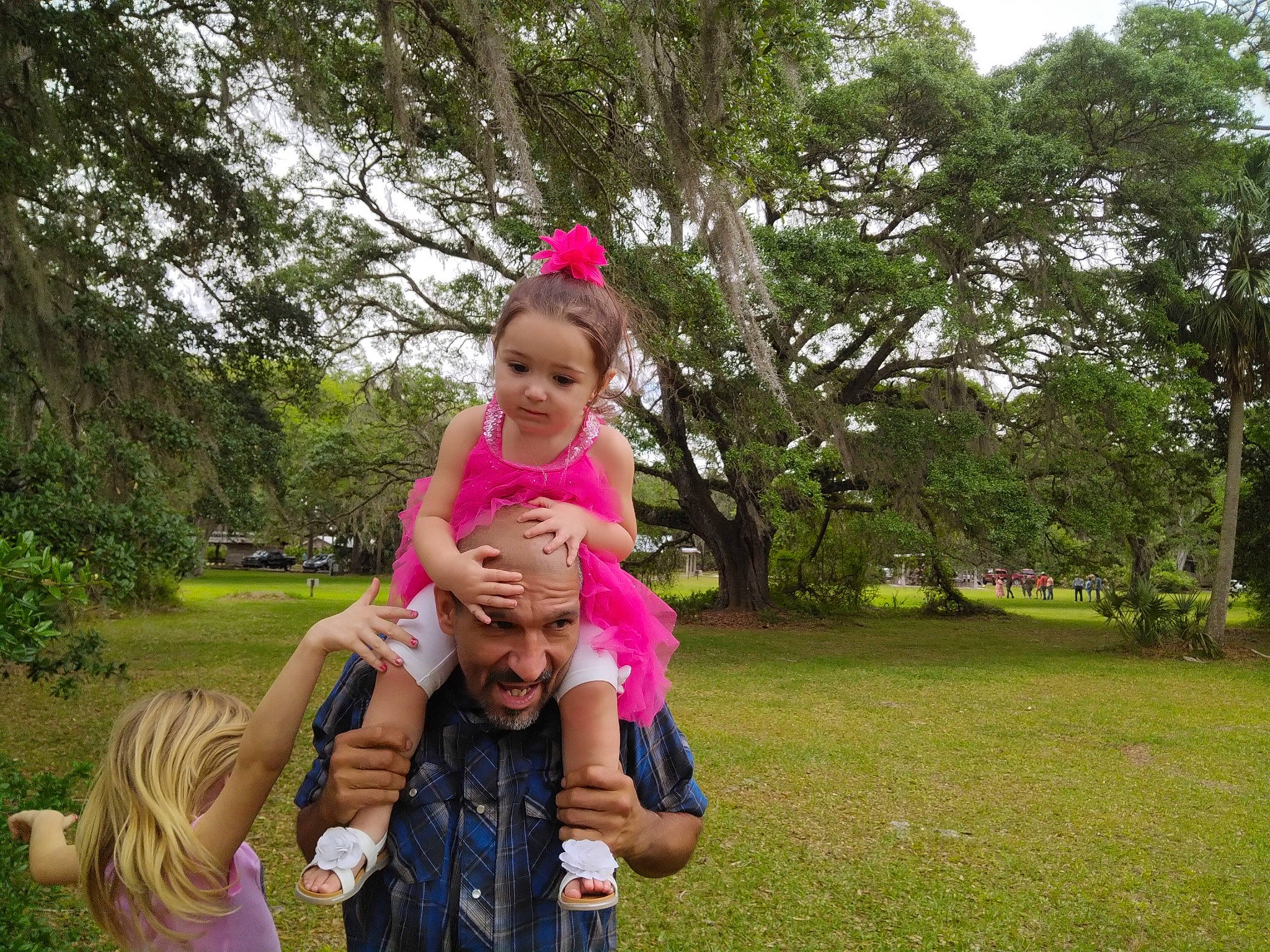 Jenna is registered to the contest to win money with this photo: baby, botany, event, fun, gesture, grass, happy, hat, headwear, landscape, lawn, leaf, leisure, magenta, people_in_nature, person, pink, plant, recreation, smile