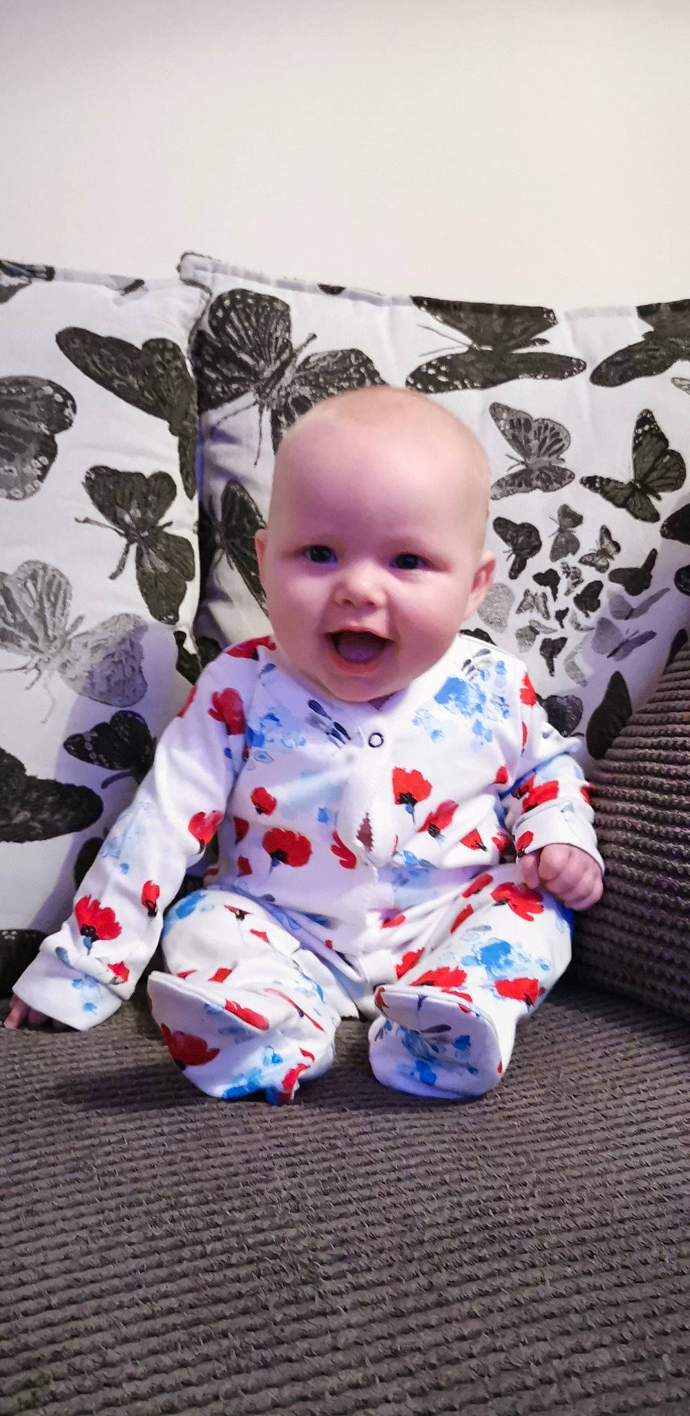 Amelia-mae is registered to the contest to win money with this photo: baby, baby_toddler_clothing, cheek, child, design, face, head, pattern, person, product, room, sitting, sleeve, smile, textile, toddler