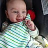 Jayce is registered to the contest to win money with this photo: baby, smile, blanket, striped_blanket, plush_toy, infant, cute, cozy, seat, child, happy, face, hand, clothing, pattern, comfort, indoors, soft_toy, expression, resting