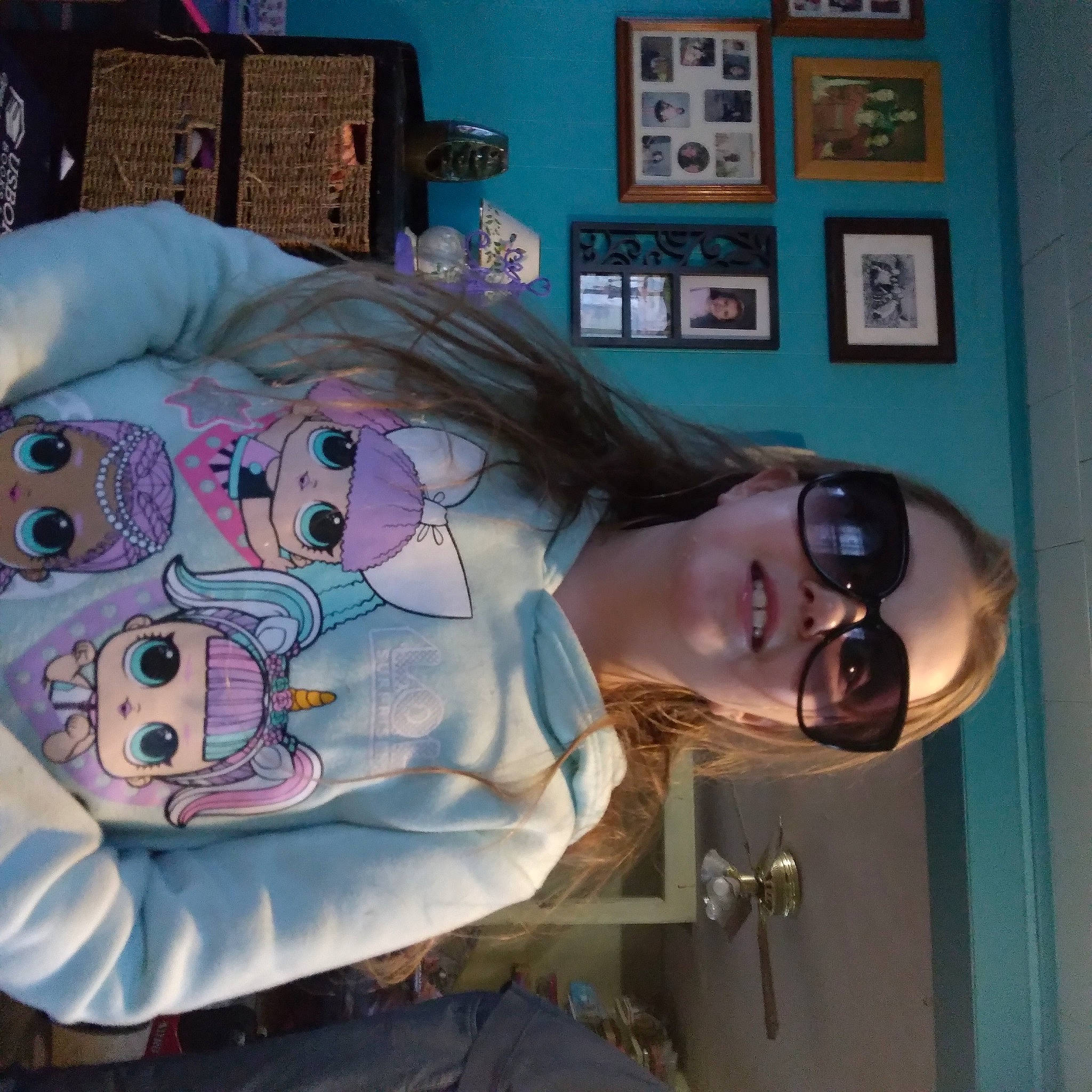 Alissalee is registered to the contest to win money with this photo: child, comfort, eyewear, flesh, fun, joy, linens, mouth, person, picture_frame, room, sunglasses, toy, vision_care, visual_arts