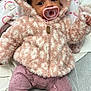 Ryleigh joined the competition — help win amazing prizes! baby, blanket, bodypart, bonnet, clothing, coat, face, finger, hand, hat, head, hood, hoodie, jacket, knitwear, person, photography, portrait, sweater, sweatshirt
