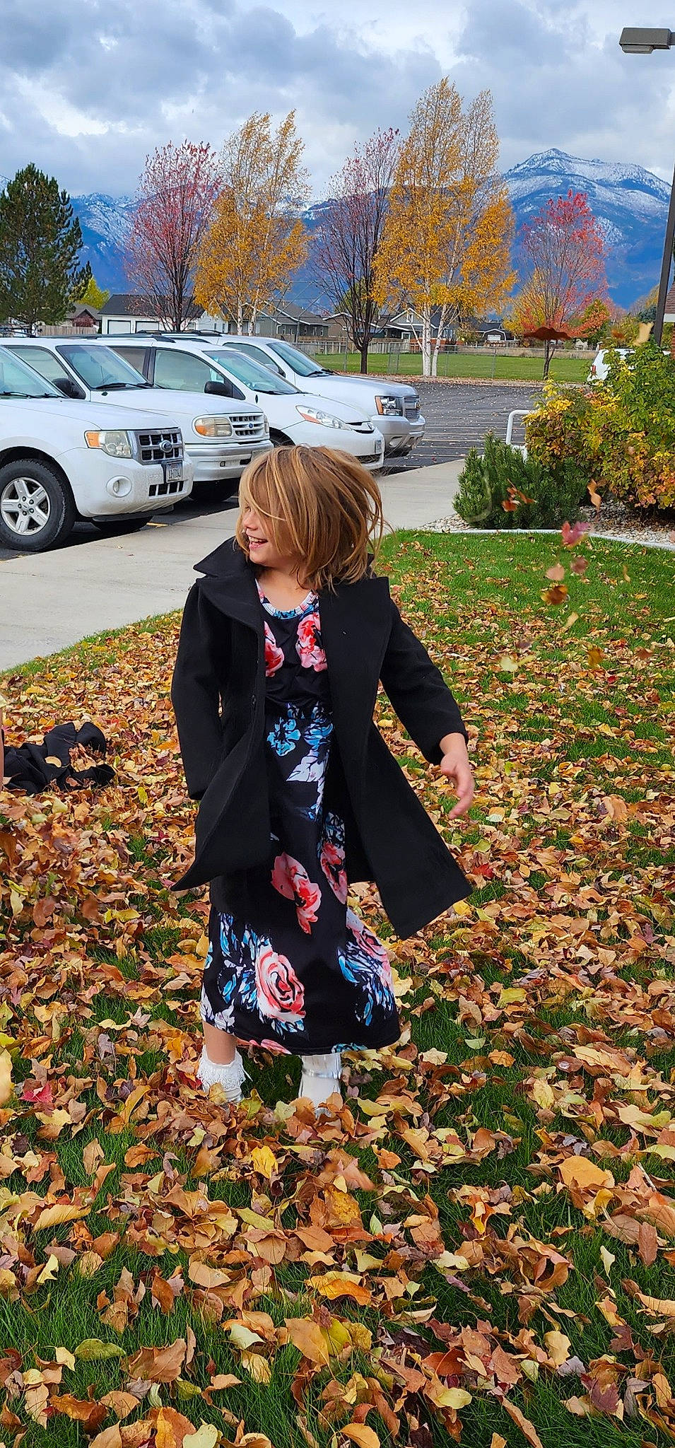 Zariah is registered to the contest to win money with this photo: car, child, deciduous, fun, grass, land_vehicle, lawn, outerwear, pattern, people_in_nature, person, plant, sidewalk, sleeve, tire, toddler, tree, vehicle, vehicle_door, wheel