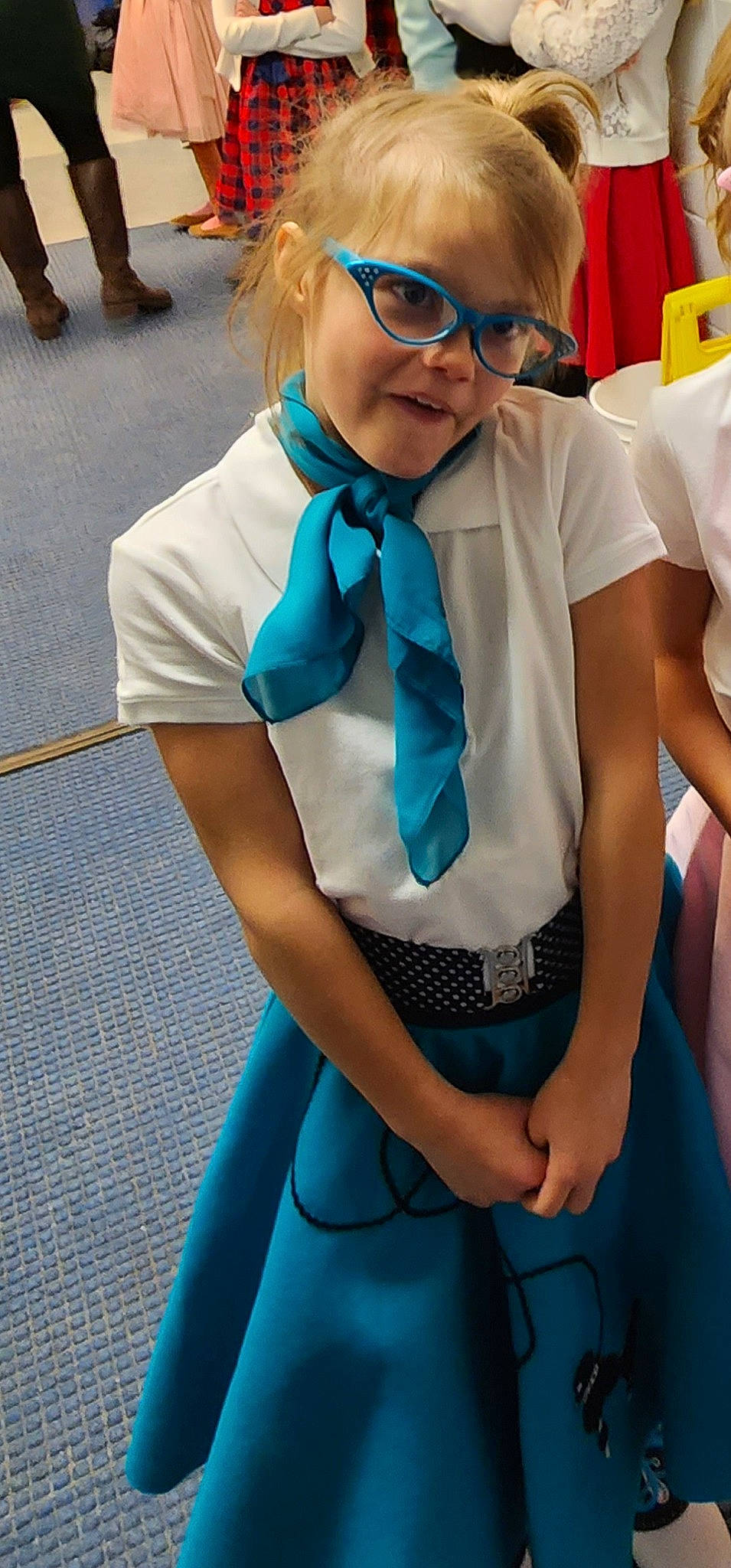 Zariah is registered to the contest to win money with this photo: azure, blue, bow_tie, costume, dress, electric_blue, event, eyewear, glasses, happy, human_leg, joint, knee, pattern, person, photograph, shoulder, smile, thigh, tie