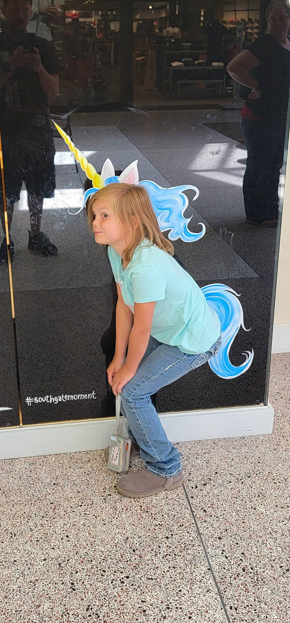 Aviana is registered to the contest to win money with this photo: asphalt, costume, denim, electric_blue, fun, human_leg, knee, leg, long_hair, pedestrian, person, road, road_surface, shoe, sidewalk, sitting, sneakers, street, t_shirt, thigh