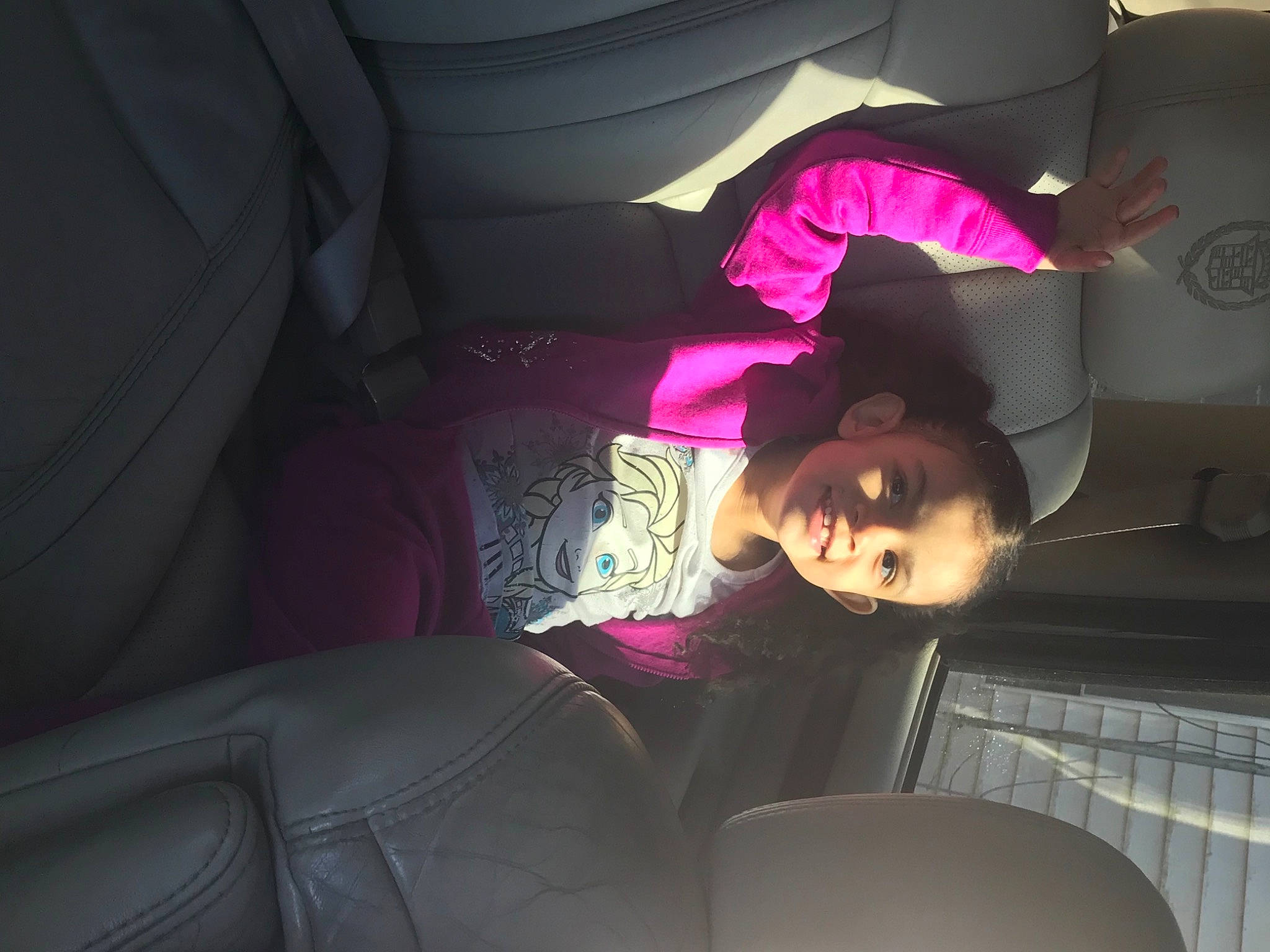 Azaleia Michelle is registered to the contest to win money with this photo: automotive_design, black_hair, car_seat, child, comfort, darkness, eyewear, fashion_accessory, flash_photography, fun, hat, human_leg, joy, luxury_vehicle, magenta, mouth, person, pink, purple, sun_hat