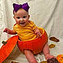baby, pumpkin, purple_bow, smiling, autumn_leaves, orange, yellow_shirt, cute, infant, fall, holiday, costume, playful, sitting, white_background, happy, child, seasonal, portrait, fun