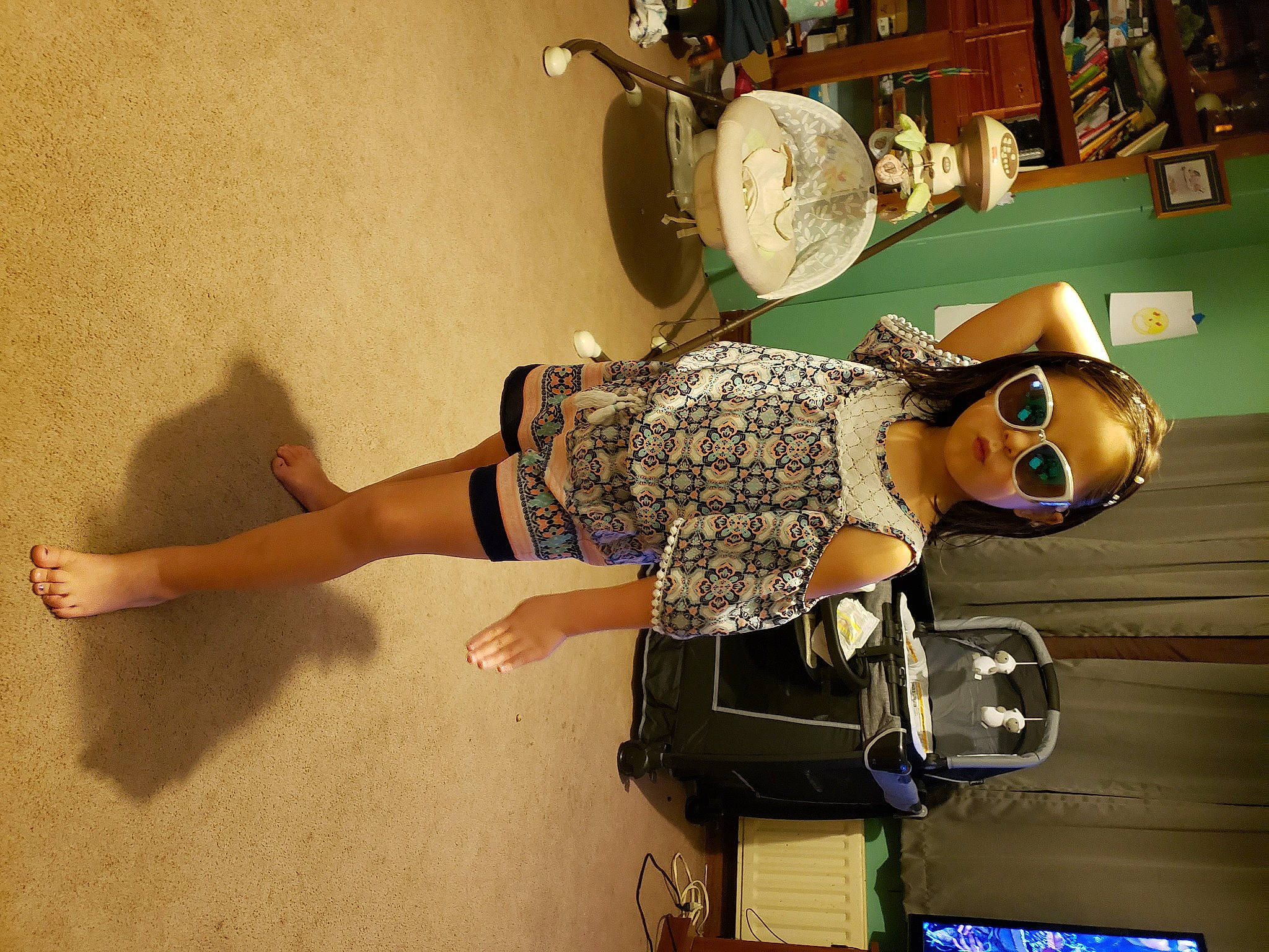 Payton is registered to the contest to win money with this photo: drum, elbow, eyewear, fashion_accessory, fashion_design, flooring, fun, goggles, hairstyle, hat, human_leg, knee, person, sitting, street_fashion, sunglasses, thigh, vision_care, waist, wood