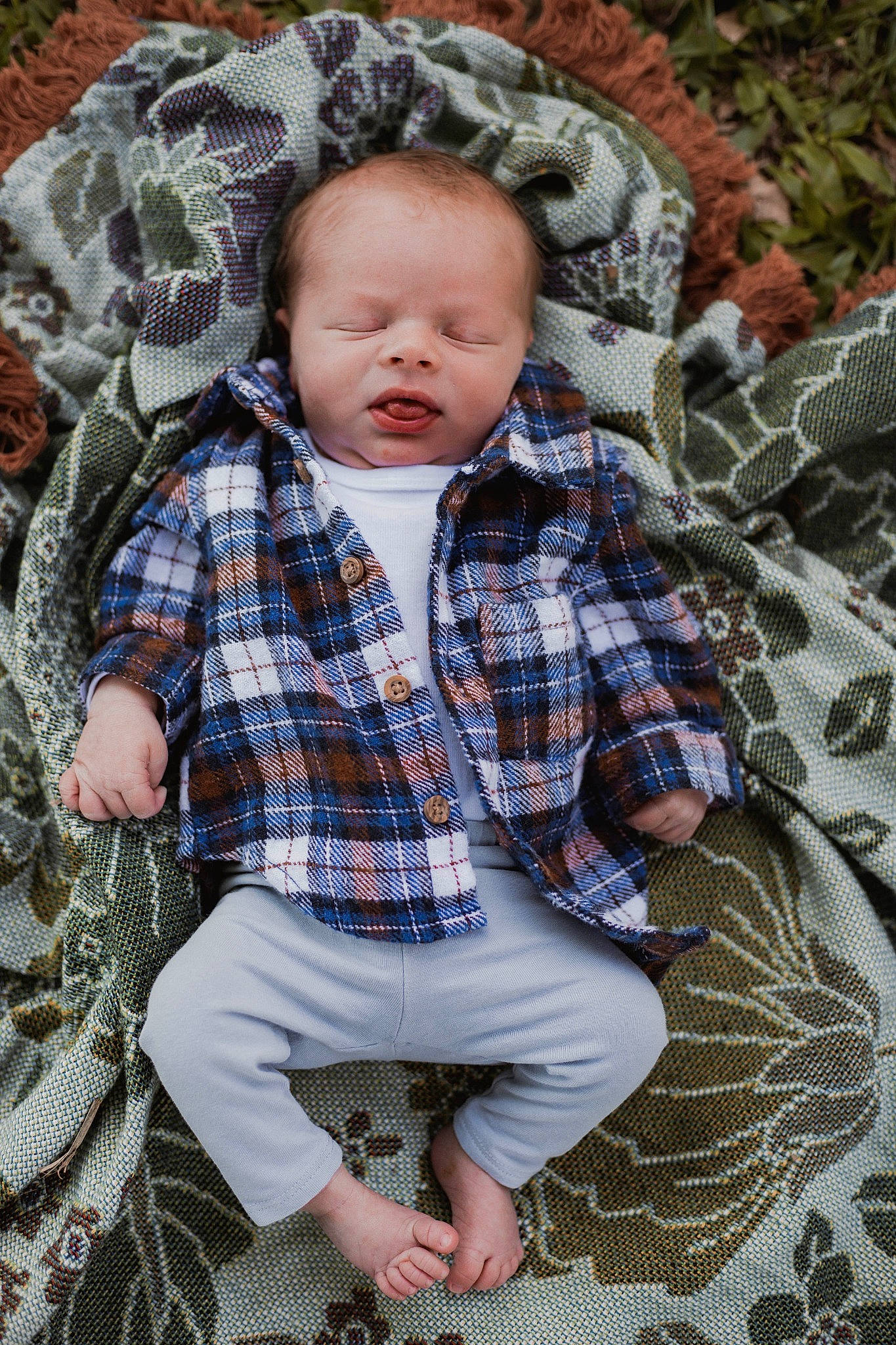 Hunter is registered to the contest to win money with this photo: baby, baby_toddler_clothing, child, eye, fun, grass, head, linens, pattern, people_in_nature, person, photograph, plaid, plant, sitting, sleeve, tartan, textile, toddler, tree