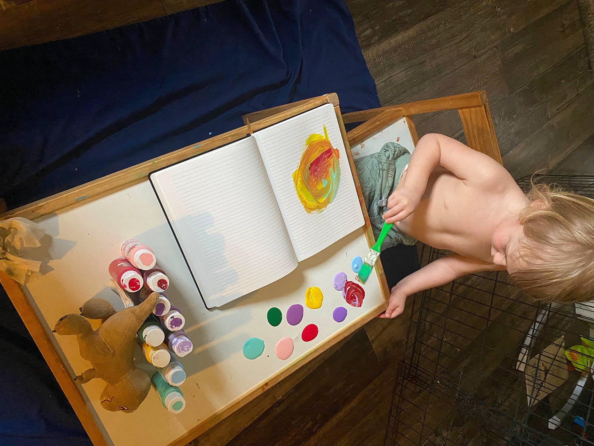 Dominick is registered to the contest to win money with this photo: art, child, flooring, fun, games, illustration, leisure, office_supplies, paper, paper_product, person, play, recreation, room, stationery, table, toddler, tree, visual_arts, wood