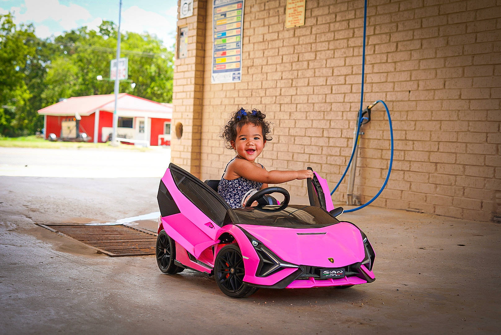 Harmony joined the competition — help win amazing prizes! asphalt, automotive_design, automotive_exterior, automotive_lighting, automotive_tire, bumper, car, dress, joy, leisure, motor_vehicle, person, rim, sunglasses, tints_and_shades, tire, toddler, tree, vehicle, vehicle_door