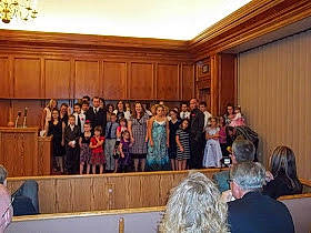 Taylor is registered to the contest to win money with this photo: audience, blurred, building, ceremony, event, meeting, person, room, seminar, under_exposed