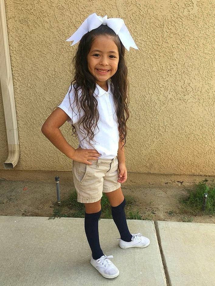 Saida De Pesto Amarelinha joined the competition — help win amazing prizes! child, child_model, clothing, costume, footwear, joy, knee, outerwear, person, shoe, smile, t_shirt, uniform