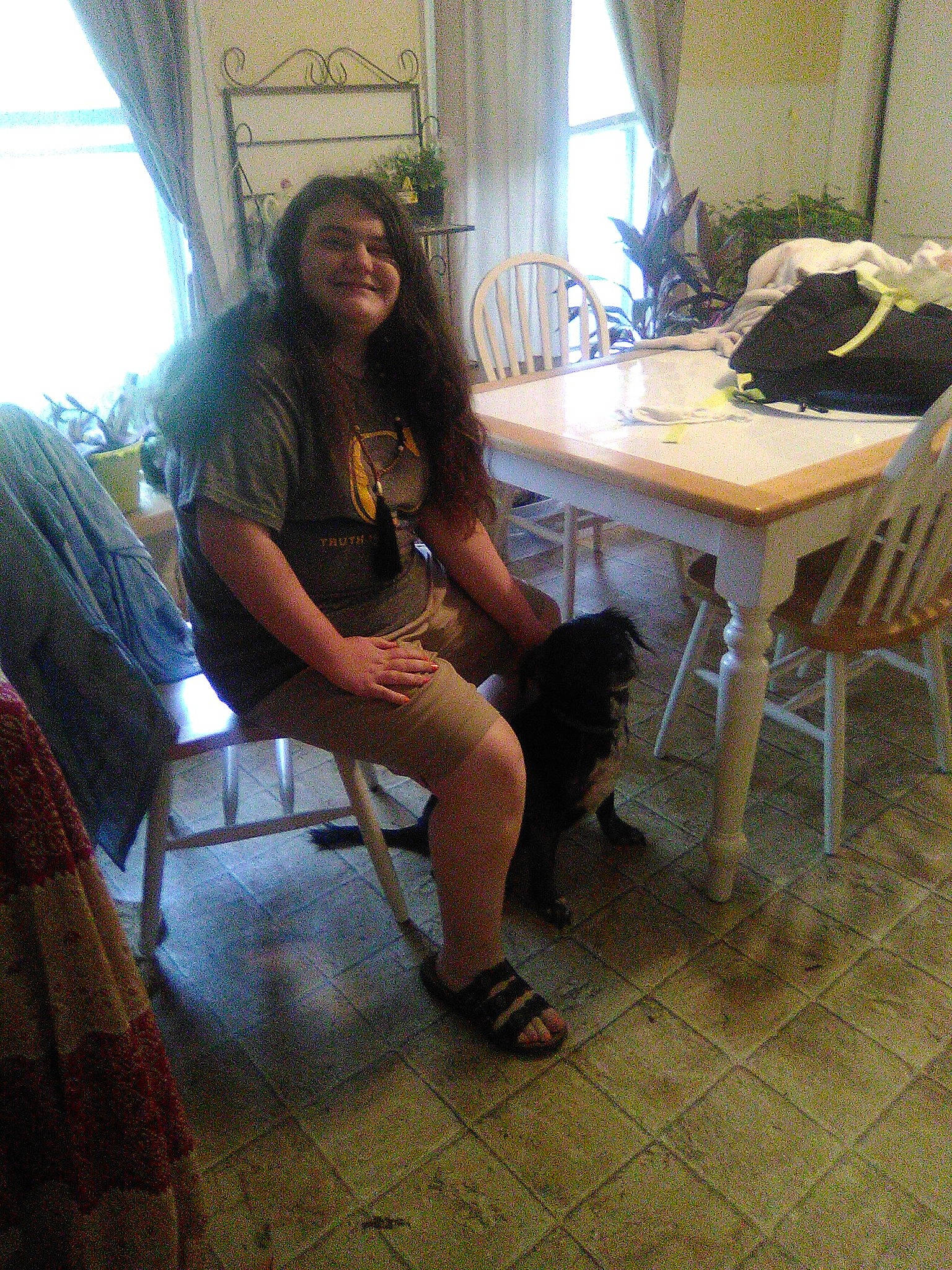 Evee is registered to the contest to win money with this photo: floor, flooring, house, human_leg, joy, leg, long_hair, person, room, sitting, table, vacation, wood