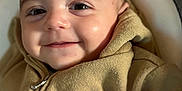 Wyatt participe au concours pour gagner de l'argent avec cette photo : baby, child, face, smile, hoodie, clothing, person, infant, portrait, happy, cute, young, closeup, cozy, warm, skin, eyes, indoor, resting, soft