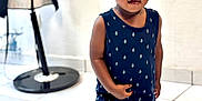 Aboubakar Khalil participe au concours pour gagner de l'argent avec cette photo : toddler, child, indoor, floor, tile, navy_blue, outfit, anchors, sandals, standing, curious, short_hair, black_coat, coat_stand, background, white_wall, person, young_child, casual_clothing, expression