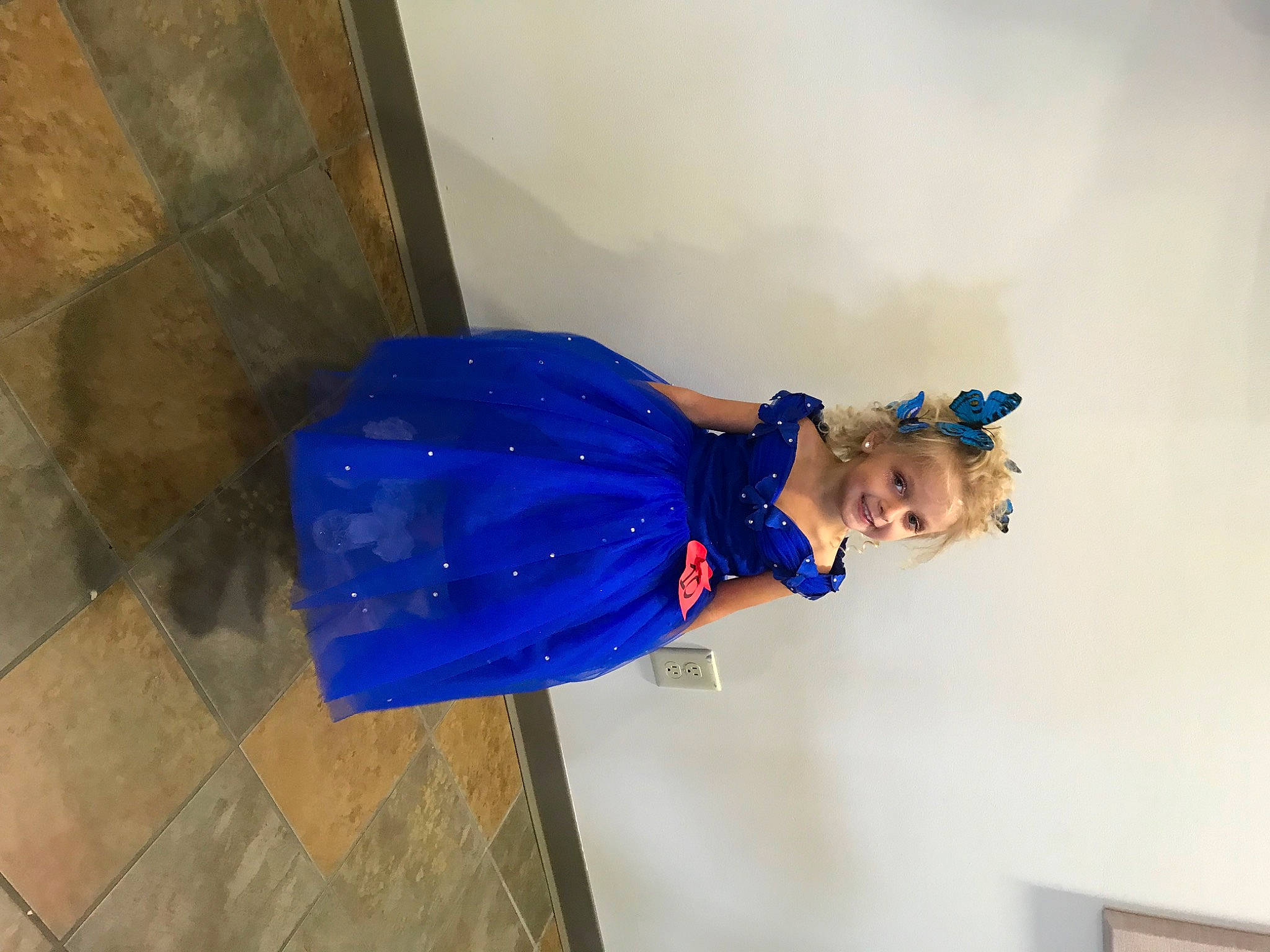 Rose joined the competition — help win amazing prizes! electric_blue, flooring, fun, hardwood, hat, joy, person, plaster, raincoat, room, sleeve, wood