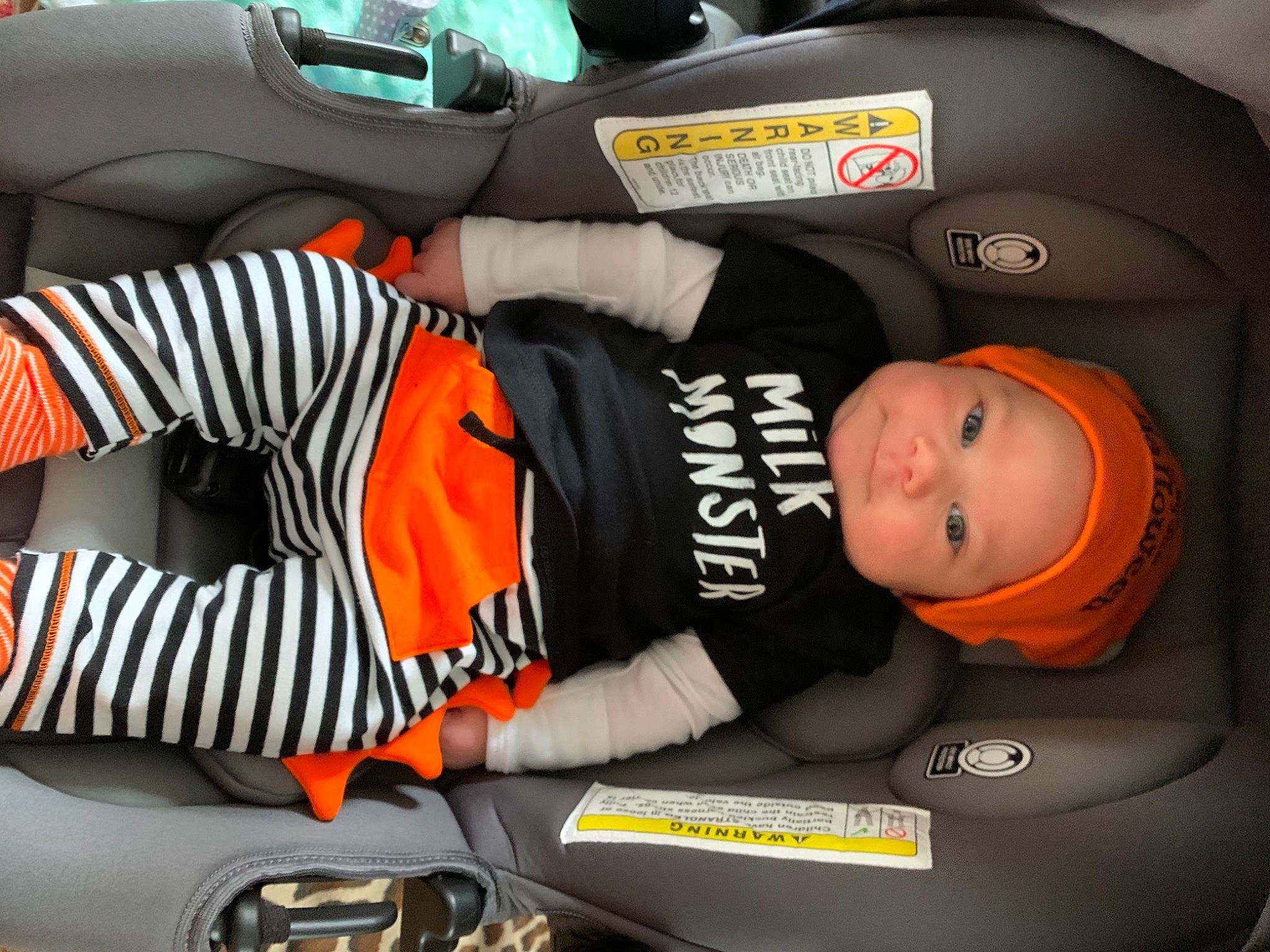 Kj is registered to the contest to win money with this photo: auto_part, baby, baby_in_car_seat, car_seat, car_seat_cover, child, headwear, person, product, vehicle