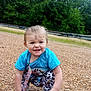 Victoria is registered to the contest to win money with this photo: toddler, child, outdoor, gravel, blue_shirt, leopard_print, pants, squatting, smiling, playful, forest, trees, nature, sandals, daylight, grass, young_child, person, cute, happy